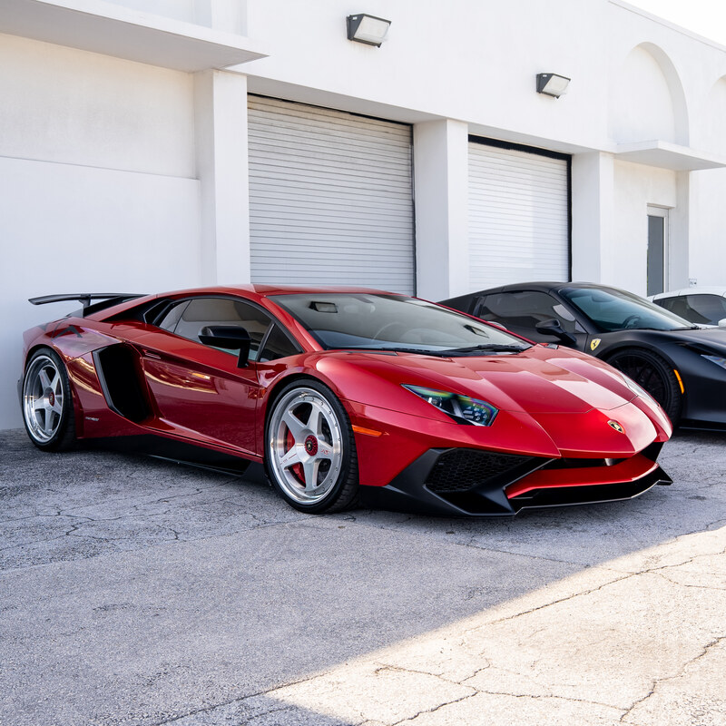 7C Wheels on deep red Lamborghini Aventador, front three-quarter detail