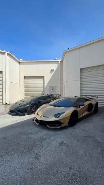 Twin Lamborghini Aventador SVJ wraps, warehouse bay