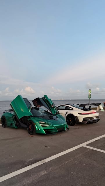 McLaren Artura and Porsche 911 waterfront